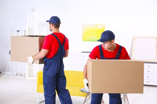 Professional house removalists in Greenwich loading furniture carefully