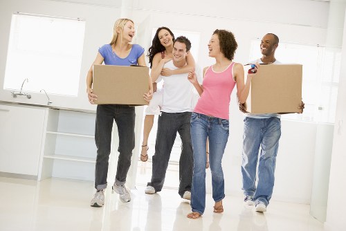 Removal team preparing a move in Greenwich with boxes and furniture