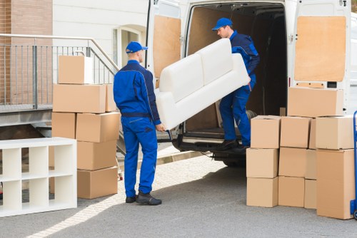 Removal team preparing a Greenwich home move with boxes and furniture