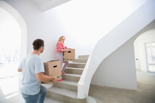 Professional movers handling household items during a Greenwich relocation