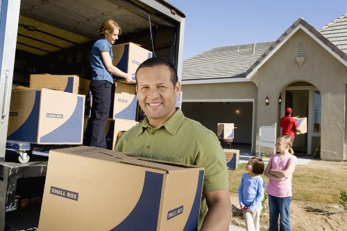 Local removal crew transporting furniture for a short notice move